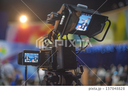 Professional Broadcast Video Camera Monitoring Live Event with Two Screens and Copy Space Professional Broadcast Video Camera Monitoring Live Event with Two Screens and Copy Space 137848828