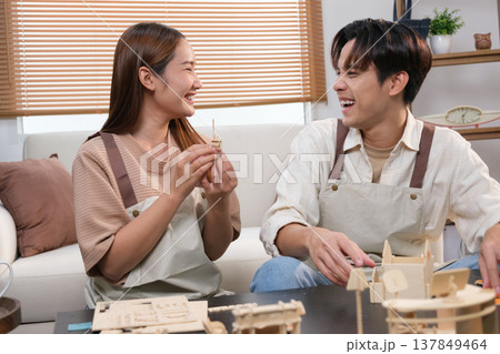 A young Asian couple spend time together at home A young Asian couple spend time together at home 137849464