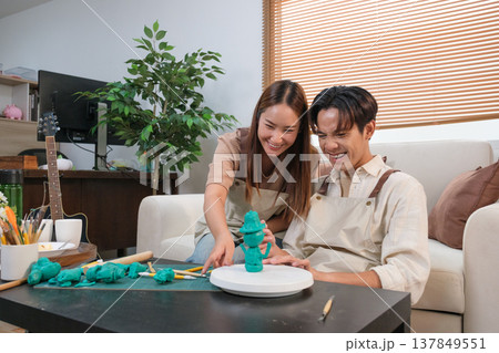 A young Asian couple spend time together at home A young Asian couple spend time together at home 137849551