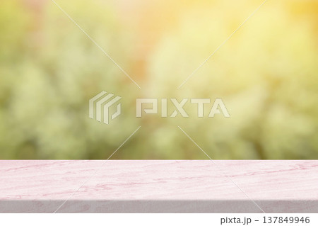 Marble Toptable with Blurred Green Garden and Light Leak Background. 137849946