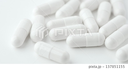White pills on a white background White pills on a white background 137851155