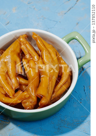 asian boneless chicken feet in a casserole 137852110