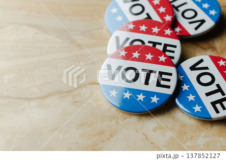 several vote badges scattered on a table several vote badges scattered on a table 137852127