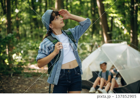 Three friends. Girls kids are in the forest, hike conception Three friends. Girls kids are in the forest, hike conception 137852905