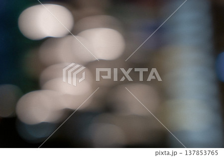 Blurred background with soft bokeh lights in various colors creating an abstract visual effect suitable for backgrounds or artistic designs Blurred background with soft bokeh lights in various colors creating an abstract visual effect suitable for backgrounds or artistic designs 137853765