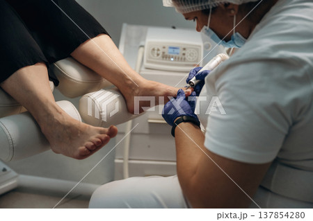 Podiatrist with client in clinic Podiatrist with client in clinic 137854280