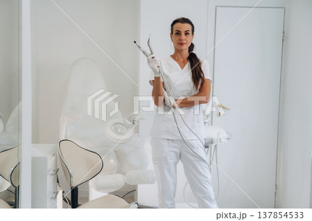 Ready for work. Podiatrist is in the clinic with equipment 137854533