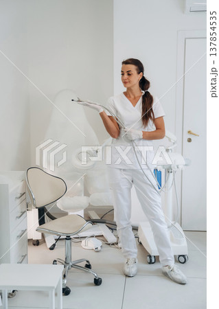 Holding equipment for peeling. Podiatrist is in the clinic with equipment 137854535