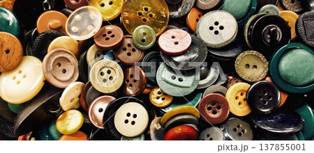 Banner close-up photo with a pile of colorful sewing buttons. Suitable for sewing, tailoring supplies, haberdashery, dressmaking and craft themes. Banner close-up photo with a pile of colorful sewing buttons. Suitable for sewing, tailoring supplies, haberdashery, dressmaking and craft themes. 137855001