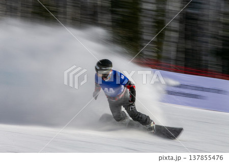 Snowboarder carving aggressive turn Snowboarder carving aggressive turn 137855476
