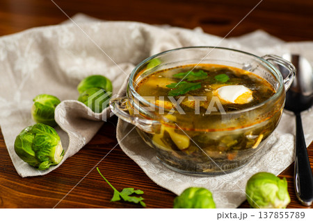Diet sorrel soup with Brussels sprouts 137855789