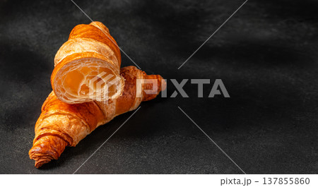 Croissants with Cut Interior on Black Background 137855860