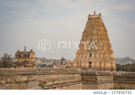 Virupaksha Temple in Hampi, India. Part of the Group of Monuments at Hampi, designated as a UNESCO World Heritage Site Virupaksha Temple in Hampi, India. Part of the Group of Monuments at Hampi, designated as a UNESCO World Heritage Site 137856742