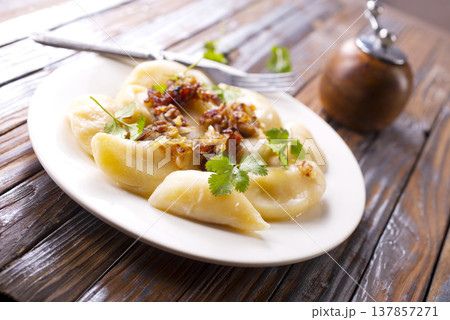 closeup of traditional ukrainian food - dumplings varenik closeup of traditional ukrainian food - dumplings varenik 137857271