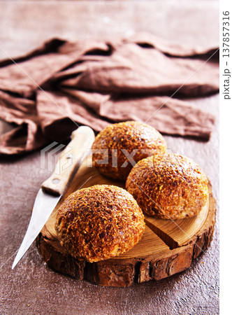 Homemade buns on a baking sheet. Delicious breakfast 137857316