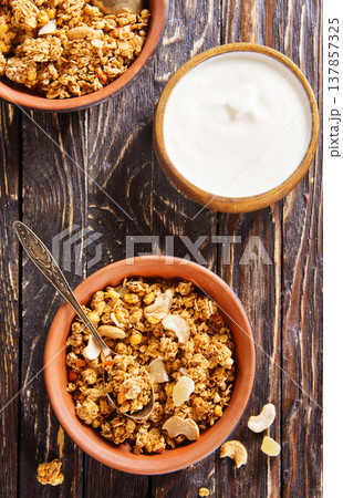 Homemade granola with white sauce Homemade granola with white sauce 137857325