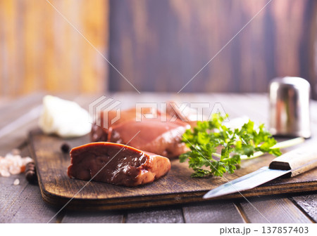 Image of raw liver with garlic and greens during cooking Image of raw liver with garlic and greens during cooking 137857403