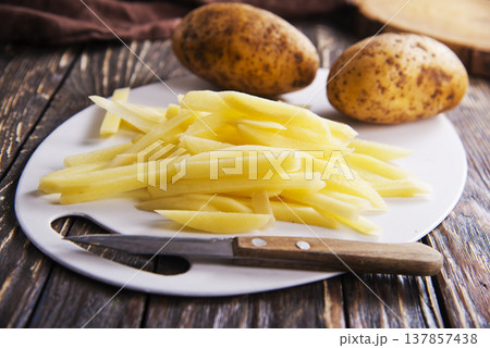 Closeup view of raw French fries. Closeup view of raw French fries. 137857438