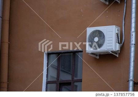 air conditioning on facade of building, air cooling in hot weather.  137857756