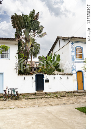 Colonial buildings with tropical palms and bicycles in Paraty Colonial buildings with tropical palms and bicycles in Paraty 137858307