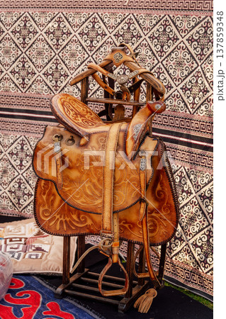 Refined Handcrafted Leather Saddle Featuring Detailed Carvings And Floral Patterns Refined Handcrafted Leather Saddle Featuring Detailed Carvings And Floral Patterns 137859348