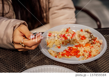 Moment Capturing Inexpensive Urban Lunch With Spicy Rice And Meticulously Manicured Nails 137859384