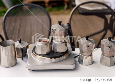 Casual Morning Coffee Ritual Outdoors. Relaxed Backyard Setup With Coffee And Rustic Elements 137859396