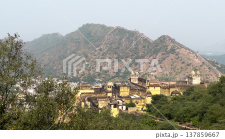 Panoramic view of Amber Fort complex set against the Aravalli hills near Jaipur. Historic Indian Panoramic view of Amber Fort complex set against the Aravalli hills near Jaipur. Historic Indian 137859667
