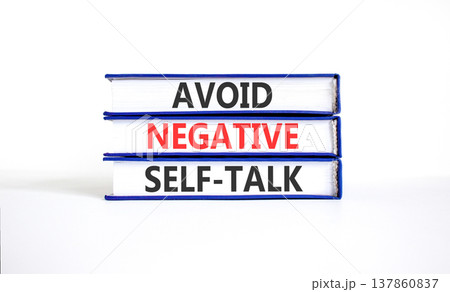 Avoid negative self-talk symbol. Concept words Avoid negative self-talk on beautiful books. Beautiful white table white background. Business psychology avoid negative self-talk concept. Copy space. 137860837