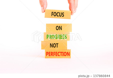 Progress or perfection words symbol. Concept words Focus on progress not perfection on beautiful wooden blocks. Beautiful white paper background. Business progress or perfection concept. Copy space. Progress or perfection words symbol. Concept words Focus on progress not perfection on beautiful wooden blocks. Beautiful white paper background. Business progress or perfection concept. Copy space. 137860844