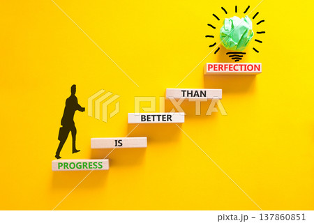 Progress or perfection words symbol. Concept words Progress is better than perfection on beautiful wooden blocks. Beautiful yellow paper background. Business progress or perfection concept. Copy space 137860851
