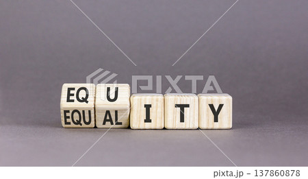 Equity and equality symbol. Concept words Equality to Equity on beautiful wooden cubes. Beautiful grey table grey background. Business, equity and equality concept. Copy space. 137860878