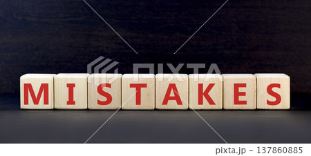 Mistakes mistake word symbol. Concept word Mistakes on beautiful wooden blocks. Beautiful black background. Business support help mistakes mistake word concept. Copy space. Mistakes mistake word symbol. Concept word Mistakes on beautiful wooden blocks. Beautiful black background. Business support help mistakes mistake word concept. Copy space. 137860885