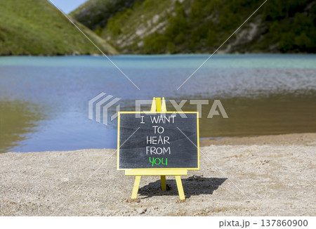 I want to hear from you symbol. Concept words I want to hear from you on beautiful black blackboard. Beautiful mountain lake background. Business support I want to hear from you concept. Copy space. 137860900
