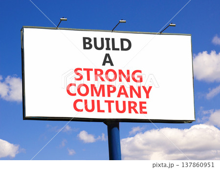Strong company culture symbol. Concept words Build a strong company culture on beautiful white billboard. Beautiful blue sky background. Business strong company culture concept. Copy space. Strong company culture symbol. Concept words Build a strong company culture on beautiful white billboard. Beautiful blue sky background. Business strong company culture concept. Copy space. 137860951