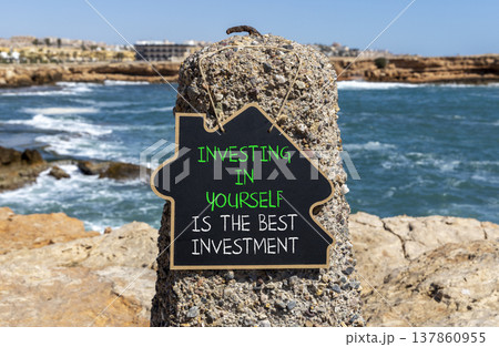Investing in yourself symbol. Concept words Investing in yourself is the best investment on beautiful black blackboard. Beautiful stone background. Business investing in yourself concept. Copy space 137860955