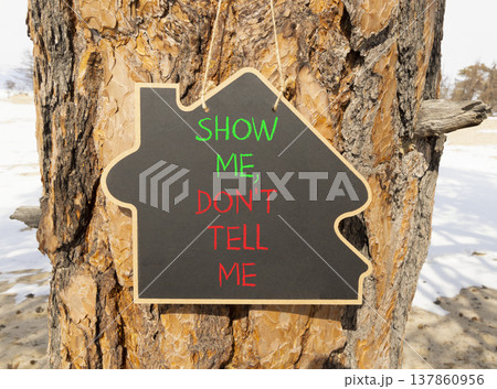 Tell or show symbol. Concept words Show me, do not tell me on beautiful black blackboard. Beautiful old pine tree background. Business tell or show concept. Copy space. Tell or show symbol. Concept words Show me, do not tell me on beautiful black blackboard. Beautiful old pine tree background. Business tell or show concept. Copy space. 137860956