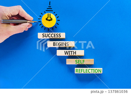 Self reflection symbol. Concept words Success begins with self reflection on beautiful wooden blocks. Beautiful blue background. Business success begins with self reflection concept. Copy space. Self reflection symbol. Concept words Success begins with self reflection on beautiful wooden blocks. Beautiful blue background. Business success begins with self reflection concept. Copy space. 137861036