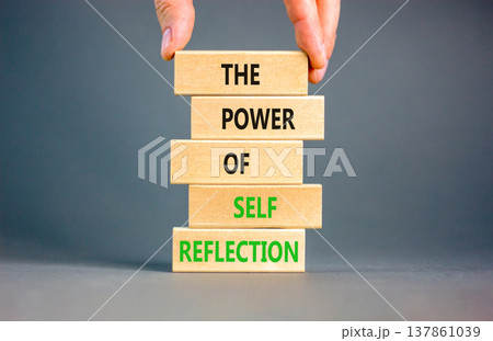 Self reflection symbol. Concept words The power of self reflection on beautiful wooden blocks. Beautiful grey background. Businessman hand. Business the power of self reflection concept. Copy space. Self reflection symbol. Concept words The power of self reflection on beautiful wooden blocks. Beautiful grey background. Businessman hand. Business the power of self reflection concept. Copy space. 137861039