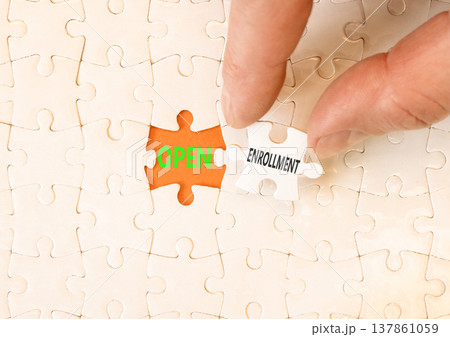 Open enrollment words symbol. Concept words Open enrollment on beautiful white puzzles. Beautiful orange background. Doctor hand. Medical and Open enrollment words concept. Copy space. Open enrollment words symbol. Concept words Open enrollment on beautiful white puzzles. Beautiful orange background. Doctor hand. Medical and Open enrollment words concept. Copy space. 137861059