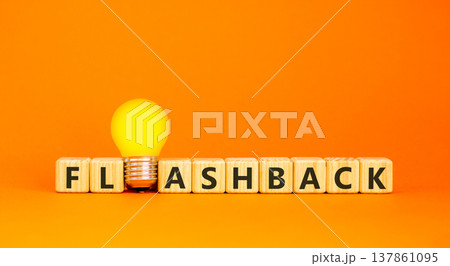 Flashback symbol. Concept word Flashback on beautiful wooden blocks. Beautiful orange background. Beautiful yellow light bulb. Business education flashback concept. Copy space. 137861095