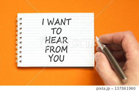 I want to hear from you symbol. Concept words I want to hear from you on beautiful white note. Beautiful orange background. Business support I want to hear from you concept. Copy space. 137861960