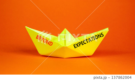 Beyond expectations words symbol. Concept words Beyond expectations on beautiful yellow paper boat. Beautiful orange background. Business and Beyond expectations words concept. Copy space. 137862004