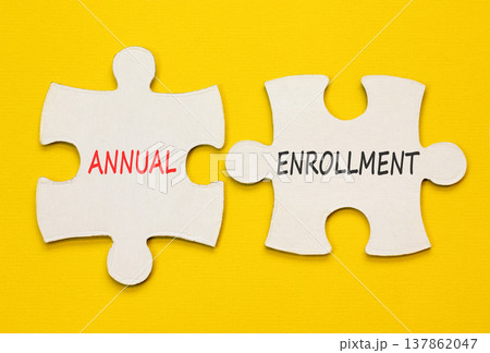 Annual enrollment words symbol. Concept words Annual enrollment on beautiful white puzzles. Beautiful yellow background. Medical and Annual enrollment words concept. Copy space. 137862047