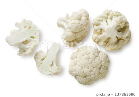 Cauliflower pieces close up on a white. Top view Cauliflower pieces close up on a white. Top view 137863690