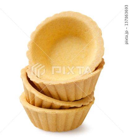 Empty tartlets stand on top of each other on a white background. Isolated 137863693