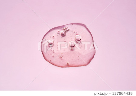 Pink cosmetic serum flowing with bubbles abstract Pink cosmetic serum flowing with bubbles abstract 137864439