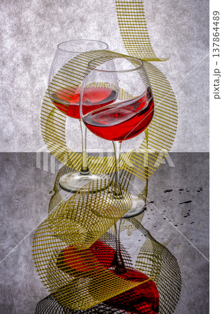 Still life with glass goblets on a gray-black background 137864489