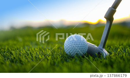 Golf clubs and balls on a green lawn in a beautiful golf course with morning sunshine. 137866179