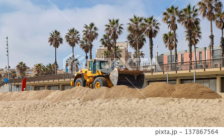 Beach restoration works in Barcelona with excavator and dump truck repairing sand on Mediterranean urban beach Beach restoration works in Barcelona with excavator and dump truck repairing sand on Mediterranean urban beach 137867564